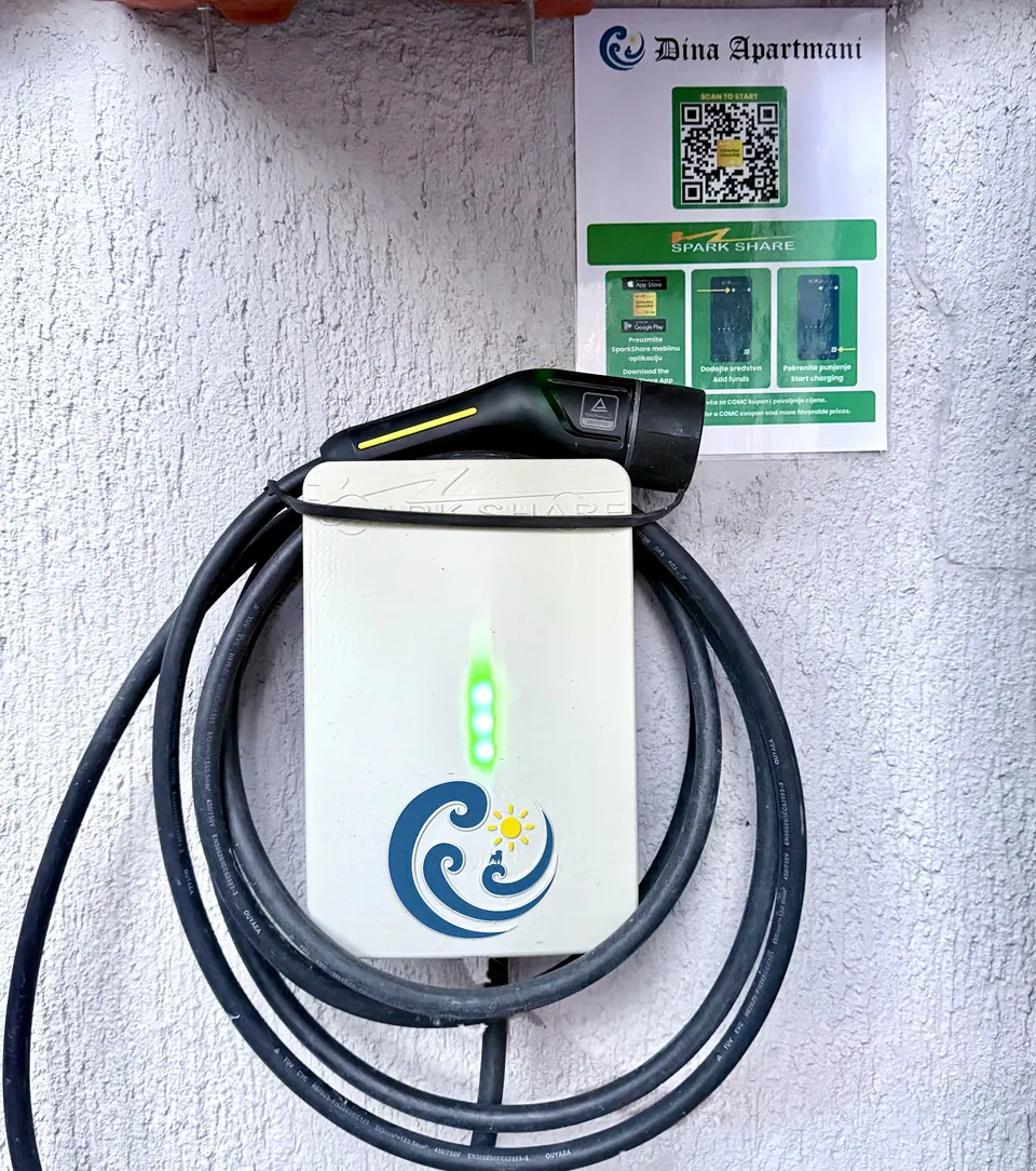 SparkShare BOXEV with the Dina Apartmani logo and a QR sign for guests in Biograd na Moru